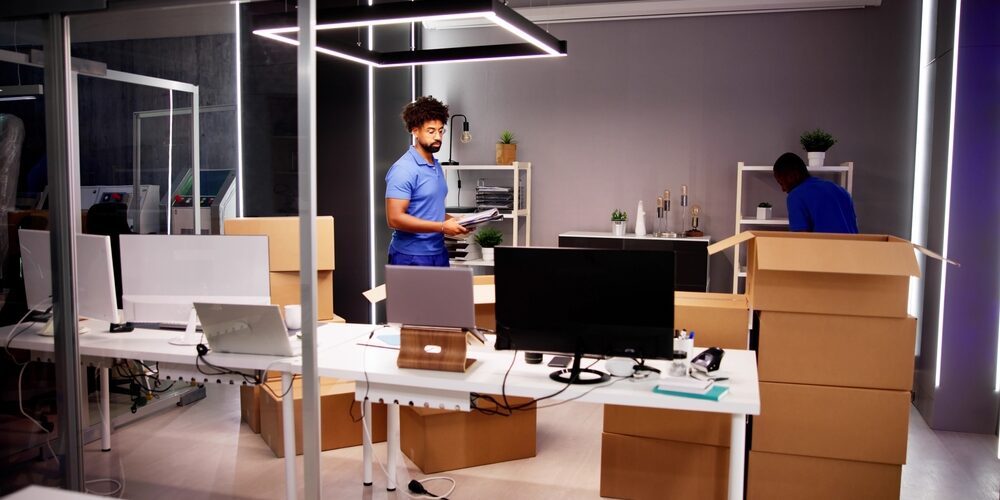 Professional,Movers,Packing,Boxes,In,Modern,Office Weekend Moves vs. After-Hours Relocations: Which Strategy Works Best for Your Business?